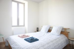 Ένα ή περισσότερα κρεβάτια σε δωμάτιο στο Appartement la Dolce Via