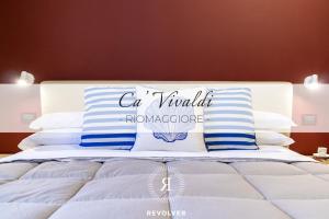 Postel nebo postele na pokoji v ubytování Cà Vivaldi penthouse 5terreparco