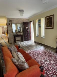 a living room with a couch with pillows on it at two Home in Sao Paulo