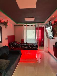 a room with a bed in the middle of it at C12 Deluxe in Cap d'Agde
