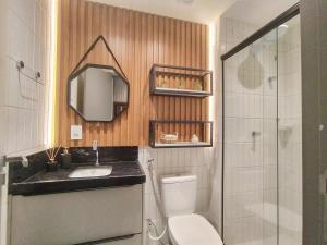 a bathroom with a toilet and a sink and a shower at Studio Manaíra #SSR802 Prox Shop in João Pessoa