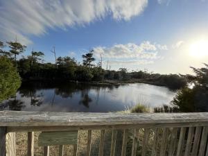 a view of a river from a deck at ISLAND DREAMING RETREAT cottage in Frisco +28 photos