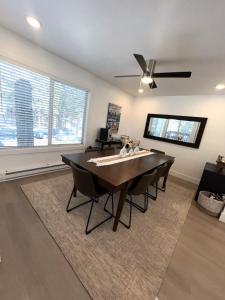 a dining room with a table and a ceiling fan at LVC0615 - Lake Therapy condo in Zephyr Cove +18 photos