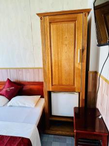 Postel nebo postele na pokoji v ubytování Tuệ Tĩnh Tower
