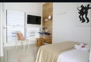 Rúm í herbergi á Begona Cliff Hotel