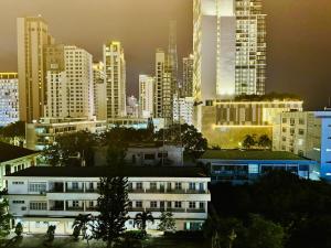 a city skyline at night with tall buildings at Tuệ Tĩnh in Nha Trang