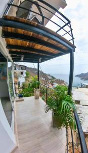 a balcony with a view of the ocean at CASA LOMA BEACH LOFT in Taganga