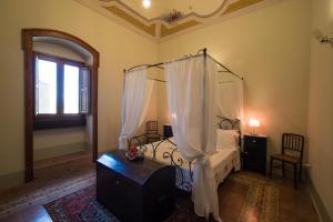 Postel nebo postele na pokoji v ubytování La Magione