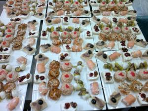 a table filled with lots of different types of pastries at Domus Viatoris in Sahagún