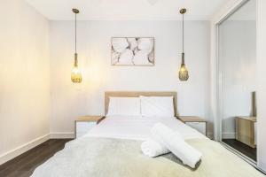 A bed or beds in a room at Coastal Getaway with Parking and Steps from the Beach
