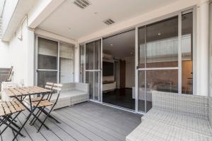 A balcony or terrace at Coastal Getaway with Parking and Steps from the Beach