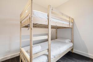 A bed or beds in a room at Coastal Getaway with Parking and Steps from the Beach