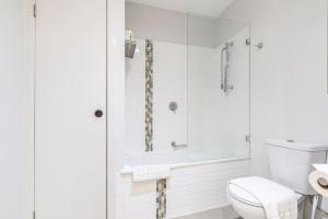 A bathroom at Coastal Getaway with Parking and Steps from the Beach