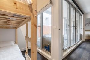 A bed or beds in a room at Coastal Getaway with Parking and Steps from the Beach