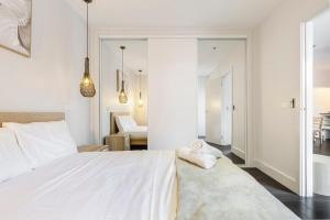 A bed or beds in a room at Coastal Getaway with Parking and Steps from the Beach