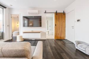 A seating area at Coastal Getaway with Parking and Steps from the Beach