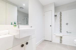 A bathroom at Coastal Getaway with Parking and Steps from the Beach