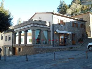 a building on a street in front of a building at Tuscany - Romantic Getaway in Montecatini Val di Cecina