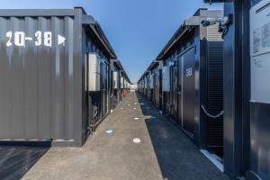 a row of train cars parked next to each other at HOTEL R9 The Yard Yabuki in Yabuki