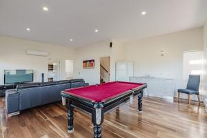 a pool table in the middle of a room at Bradford Shores Goolwa - Luxury - Wi-Fi - No Linen Included in Goolwa