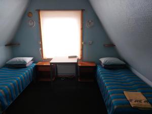 Postel nebo postele na pokoji v ubytování Livonia Matkamaja