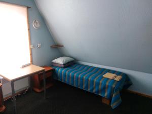 Postel nebo postele na pokoji v ubytování Livonia Matkamaja