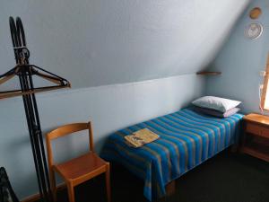 Postel nebo postele na pokoji v ubytování Livonia Matkamaja