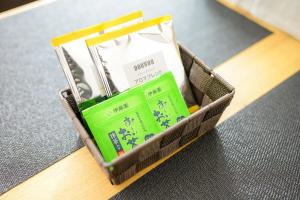 a basket ofium packets sitting on a table at バンビハイツ長島303 in Aomori