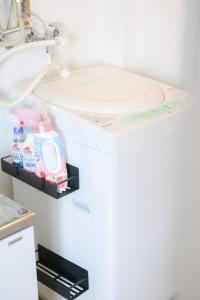 a bathroom with a toilet and a sink at バンビハイツ長島303 in Aomori +26 photos