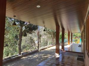a view from the hallway of a house with wooden ceiling at Devshwar Home Stay ,Payankholi, Nathwakhan in Mukteswar