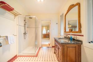 a bathroom with a shower and a sink and a mirror at 6B Luxury Rustic Farm Manor In Lang Lang in Lang Lang