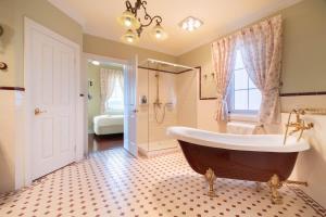 a large bathroom with a tub and a shower at 6B Luxury Rustic Farm Manor In Lang Lang in Lang Lang