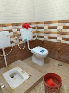 a bathroom being remodeled with a toilet in a room at Indra Family Homestay - Nearest Area to Triveni Sangam in Prayagraj
