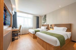 صورة لـ 沃德 Smart 酒店淄博桓台信誉楼张北路店 في تزيبو