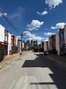 an empty street in a city with buildings at La Haus Paipa beautiful and modern house in Paipa