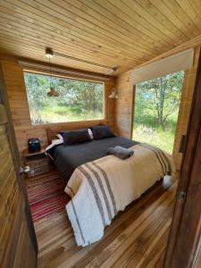 Giường trong phòng chung tại ACOGEDOR REFUGIO PRiVADO