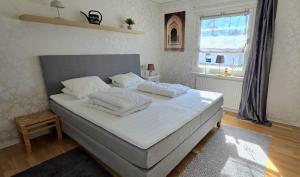 Postel nebo postele na pokoji v ubytování Hus Jonna