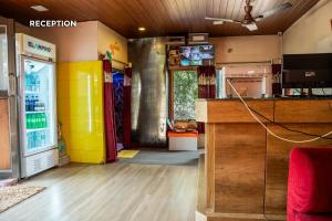a room with a refridgerator and a tv at Bhairavnath Resort and Hospitality in Lonavala
