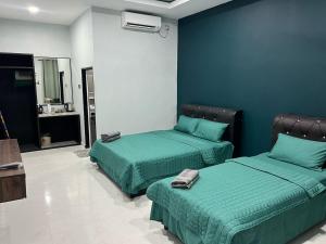 Postel nebo postele na pokoji v ubytování HMI Roomstay