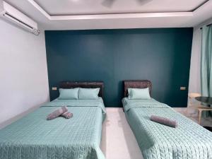 Postel nebo postele na pokoji v ubytování HMI Roomstay