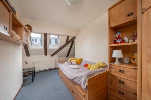 Katil atau katil-katil dalam bilik di Holiday Home in the Heart of Riga