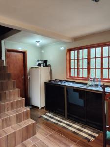 Kuchyň nebo kuchyňský kout v ubytování Chalé Magia no Recanto Shambala