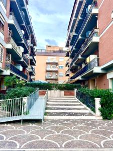 een groep gebouwen met trappen op een binnenplaats bij Raf Rhome Seaside - Center 200m to the Sea in Lido di Ostia