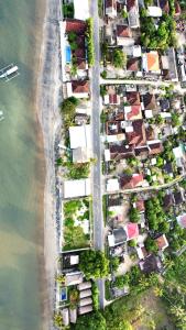 an aerial view of a house next to the beach at Krisna Bungalows and Restaurant in Sekotong