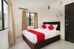 Postel nebo postele na pokoji v ubytování OYO 91130 Hotel 91 Bukit Mewah