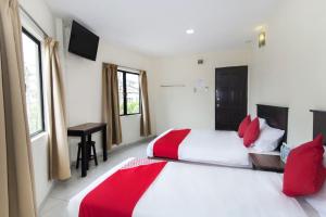 Postel nebo postele na pokoji v ubytování OYO 91130 Hotel 91 Bukit Mewah