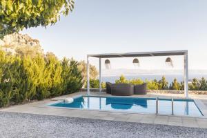 The swimming pool at or close to Evgoro Luxury Suites