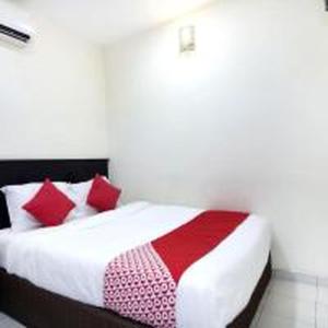 Postel nebo postele na pokoji v ubytování OYO 91130 Hotel 91 Bukit Mewah