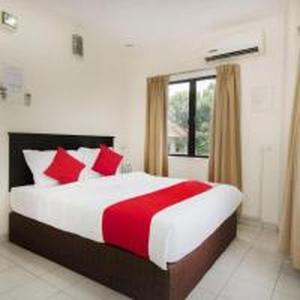 Postel nebo postele na pokoji v ubytování OYO 91130 Hotel 91 Bukit Mewah