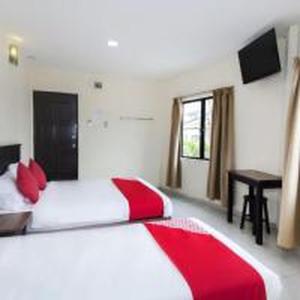 Postel nebo postele na pokoji v ubytování OYO 91130 Hotel 91 Bukit Mewah